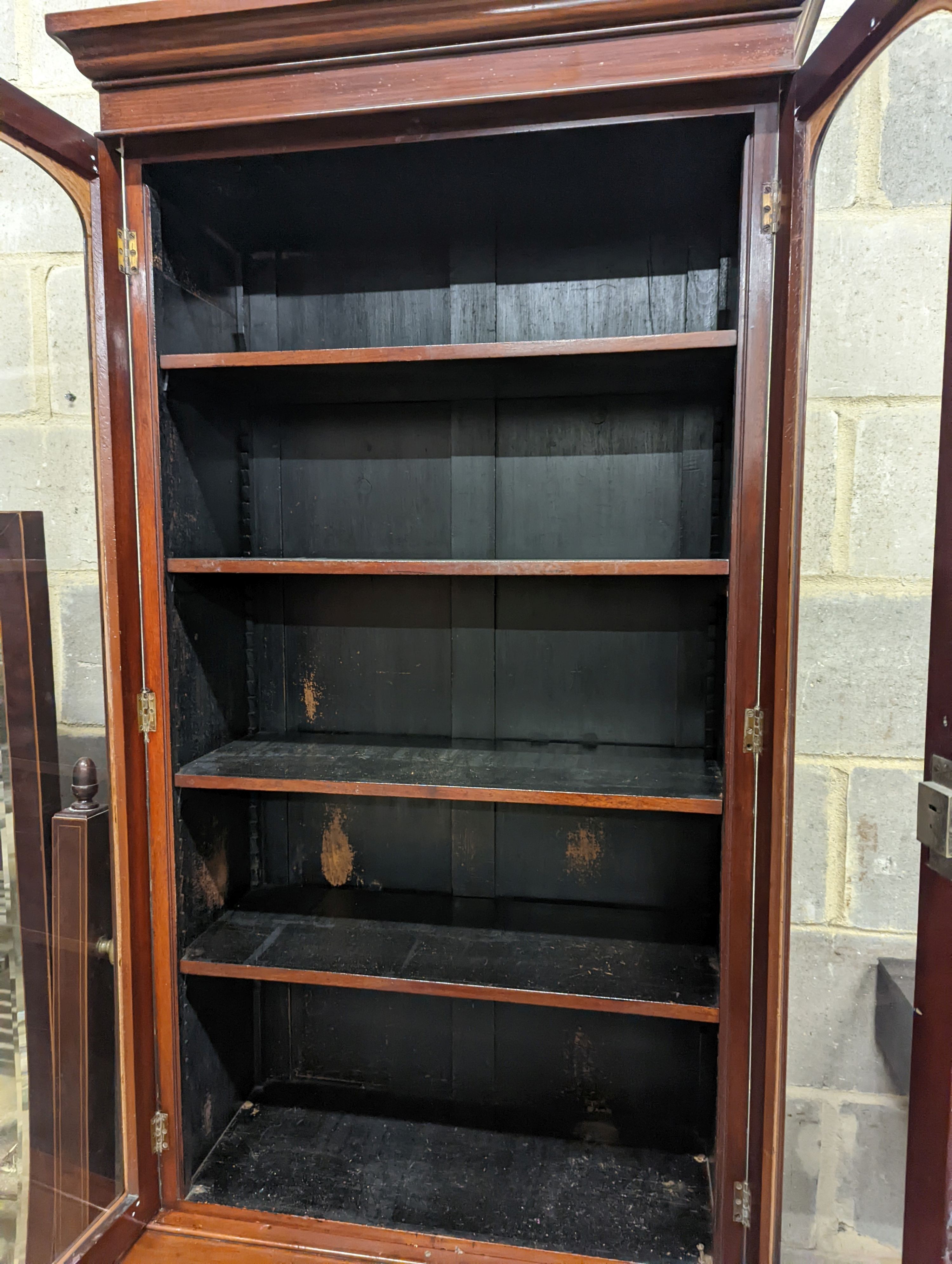 A narrow Victorian mahogany bookcase cupboard, width 71cm, depth 46cm, height 218cm